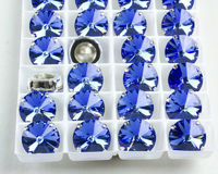 Swarovski Rivoli в серебряных цапах 1122 Dark Sapphire 14мм Австрия