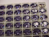 Swarovski в серебряных цапах 4100 Tanzanite 14х10мм Австрия