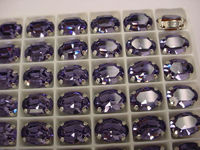 Swarovski в серебряных цапах 4100 Tanzanite 14х10мм Австрия